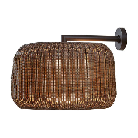 Fora A outdoor wall light with a wide, rounded Rattan Brown woven drum shade on a graphite brown wall arm and round wall plate, shown against a plain white background.