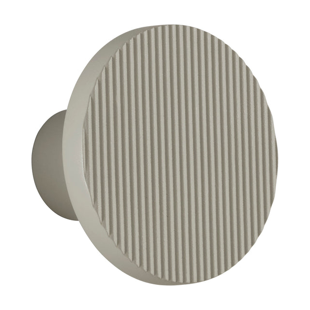 Arid A/01 round aluminium LED wall light with fine vertical fluted disc face in Textured Pebble Grey, shown on a cylindrical wall stem against a plain white background.