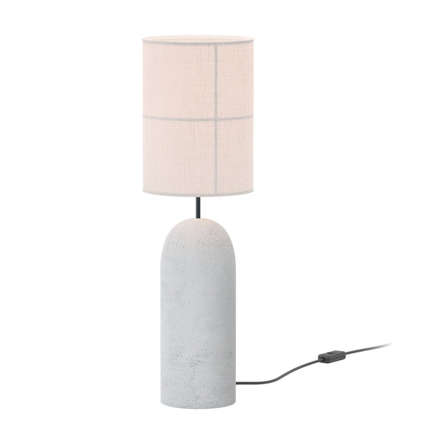 Rania table lamp with a rounded light grey concrete cylinder base, slim dark stem, and tall white cream fabric shade with grid texture, shown on a plain background with visible cable and switch.