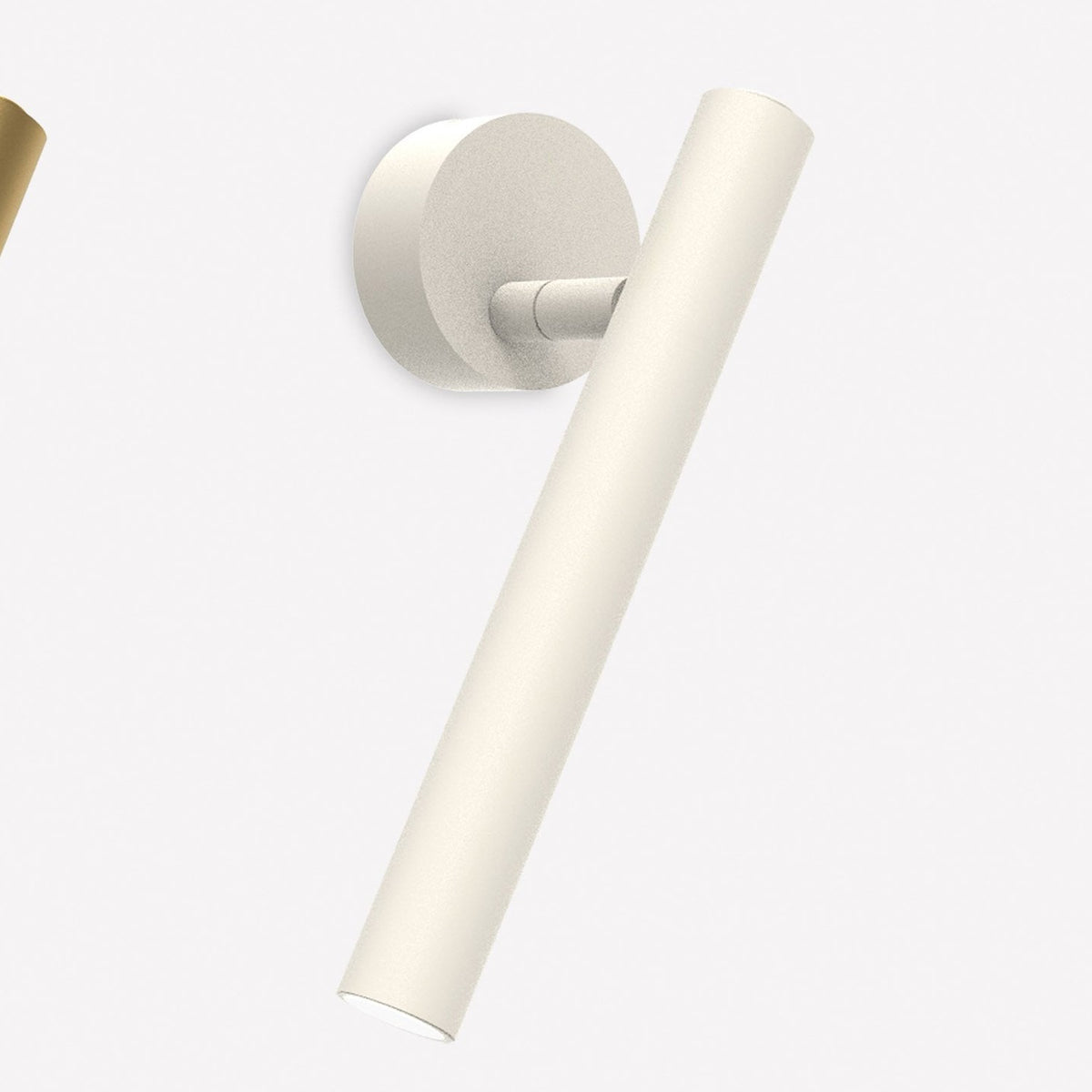 Rui LED Adjustable Wall Light with Reading Light in matt white, showing a round wall base with a slim pivoting cylindrical tube, set against a plain light background.