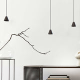 Rimini LED Cone pendant lights in matt black with conical iron shades on black textile cables, shown at varying drop heights in a neutral room setting.