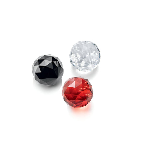 A display of three round, faceted gemstones set against a white backdrop evokes the essence of the Etherlight Crystal 6 Light Chandelier - Red. In shades of black, clear, and red, these gems elegantly reflect light to highlight their exquisite craftsmanship and are artfully arranged in a triangular formation.