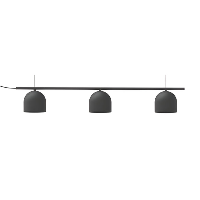 Rio Linear 3 Light Dome Chandelier in matt black iron, three dome shades suspended beneath a slim horizontal bar on fine wires, shown on a plain white background.