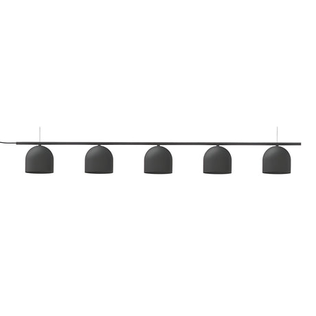 Rio Linear 5 Light Dome Chandelier in matt black iron, five small dome shades suspended at varying heights beneath a slim horizontal bar, shown on a plain white background.