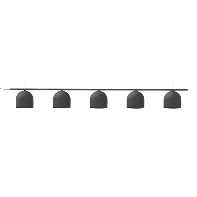 Rio Linear 5 Light Dome Chandelier in matt black iron, five small dome shades suspended at varying heights beneath a slim horizontal bar, shown on a plain white background.
