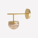 Roi single arm wall light in gold finish with a round backplate, slim straight arm, and ribbed fumé glass dome shade, shown on a plain white background.