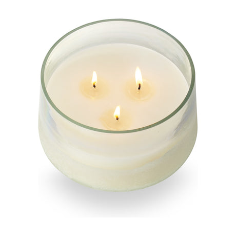 Fresh Sea Salt scented candle in a wide Baltic glass vessel with three lit cotton wicks and white soy paraffin wax, shown on a plain white background.
