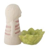 Clarabel stoneware tealight holder with a figure featuring long hair and a pink-striped top beside a scalloped green cup, shown on a plain white background.