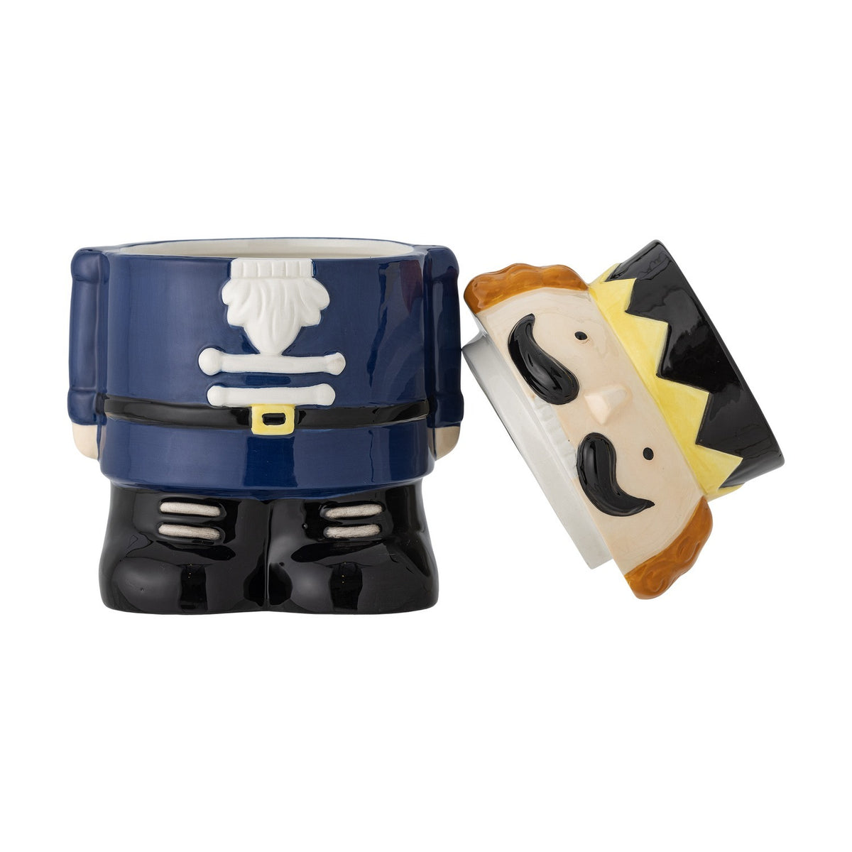 Feast Nutcracker Christmas storage jar, 900ml ceramic soldier design in navy, black and gold with lid shaped as a hat and face, shown open on a white background.