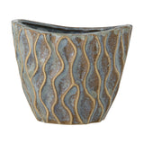 Feren Stoneware Plant Pot in blue, a small ceramic planter with an uneven rim and wavy raised lines over a speckled blue glaze, shown against a plain white background.