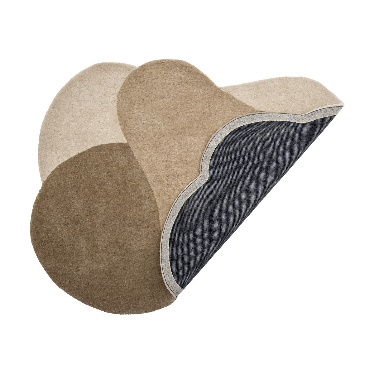 Denton Wool Rug 140x110cm in Brown, shown folded back to reveal its dark backing, with overlapping pebble-shaped sections in light to deep brown tones on a plain white background.