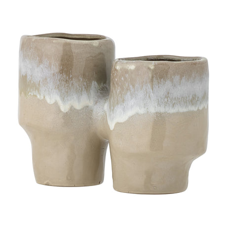Maiak Stoneware Plant Pot in beige, two joined cylindrical ceramic vessels of differing heights with a drip glaze finish, shown against a plain white background.