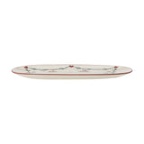 Yule Oval Stoneware Christmas Platter in cream, long oval shape with a thin red rim, decorated with a pine garland and small red hearts, shown on a plain white background.