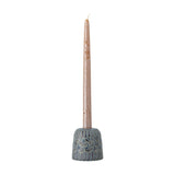 Samsin Floral Stoneware Candle Holder in blue, a small domed ceramic base with embossed floral and panel relief, holding a tall taper candle against a white background.