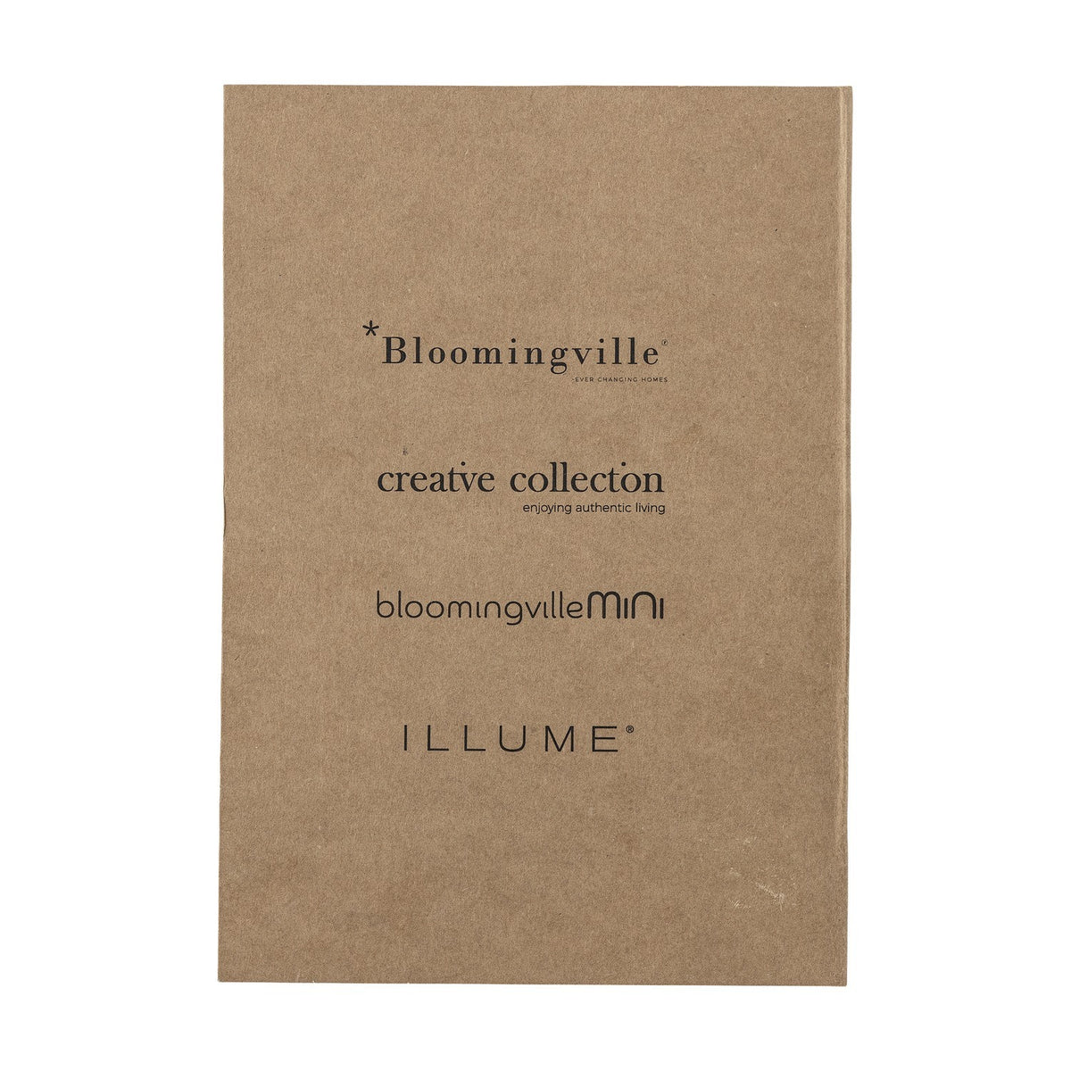 Anniversary Notebook in brown with a plain textured paper cover printed with collection logos, shown against a plain light background.