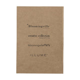 Anniversary Notebook in brown with a plain textured paper cover printed with collection logos, shown against a plain light background.