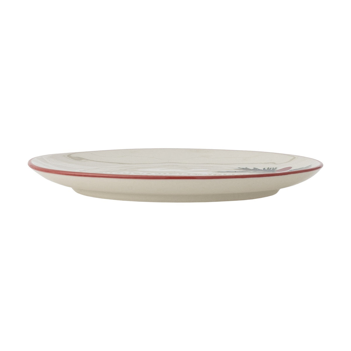 Side view of a cream stoneware Christmas side plate from the Jovida set of 4, showing its thin rim edged in red and embossed detailing, on a plain white background.