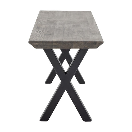 Maldon Wooden Bench in brown oak with visible grain and bevelled edge, set on crossed black iron X-frame legs, shown end-on against a plain white background.