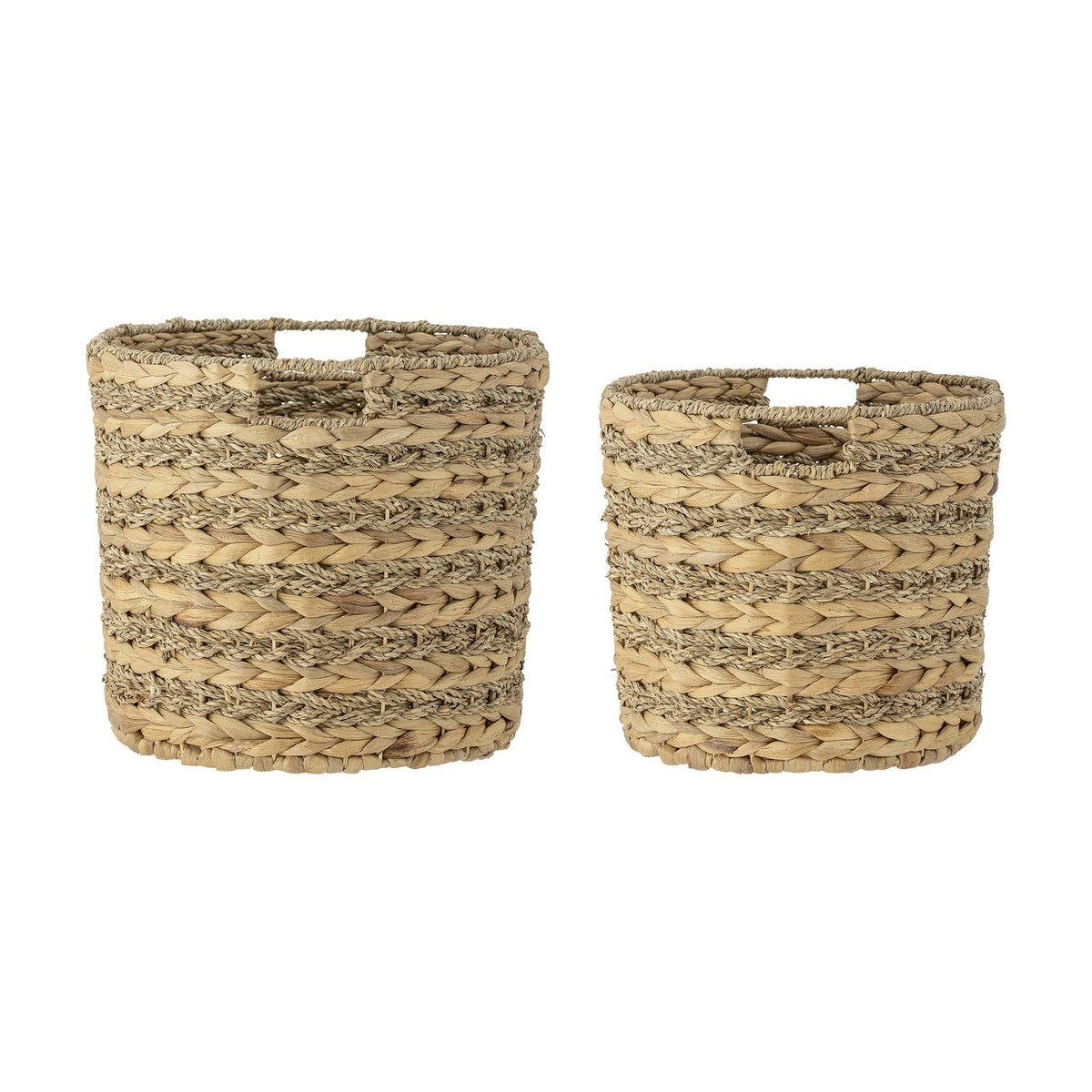 Indra Water Hyacinth Baskets Set of 2 in natural woven seagrass with cut-out handles and ribbed, plaited texture, shown in two sizes on a plain white background.
