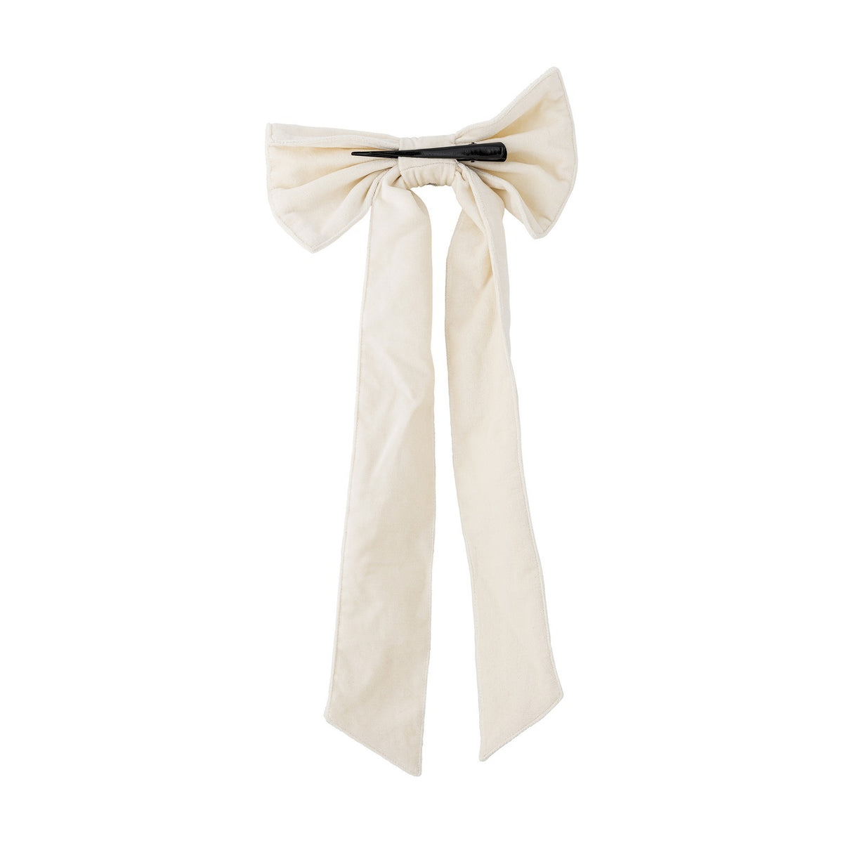 Ruby Cotton Christmas Bow in cream woven cotton with two full loops and long trailing tails, secured by a black clip, shown on a plain white background.