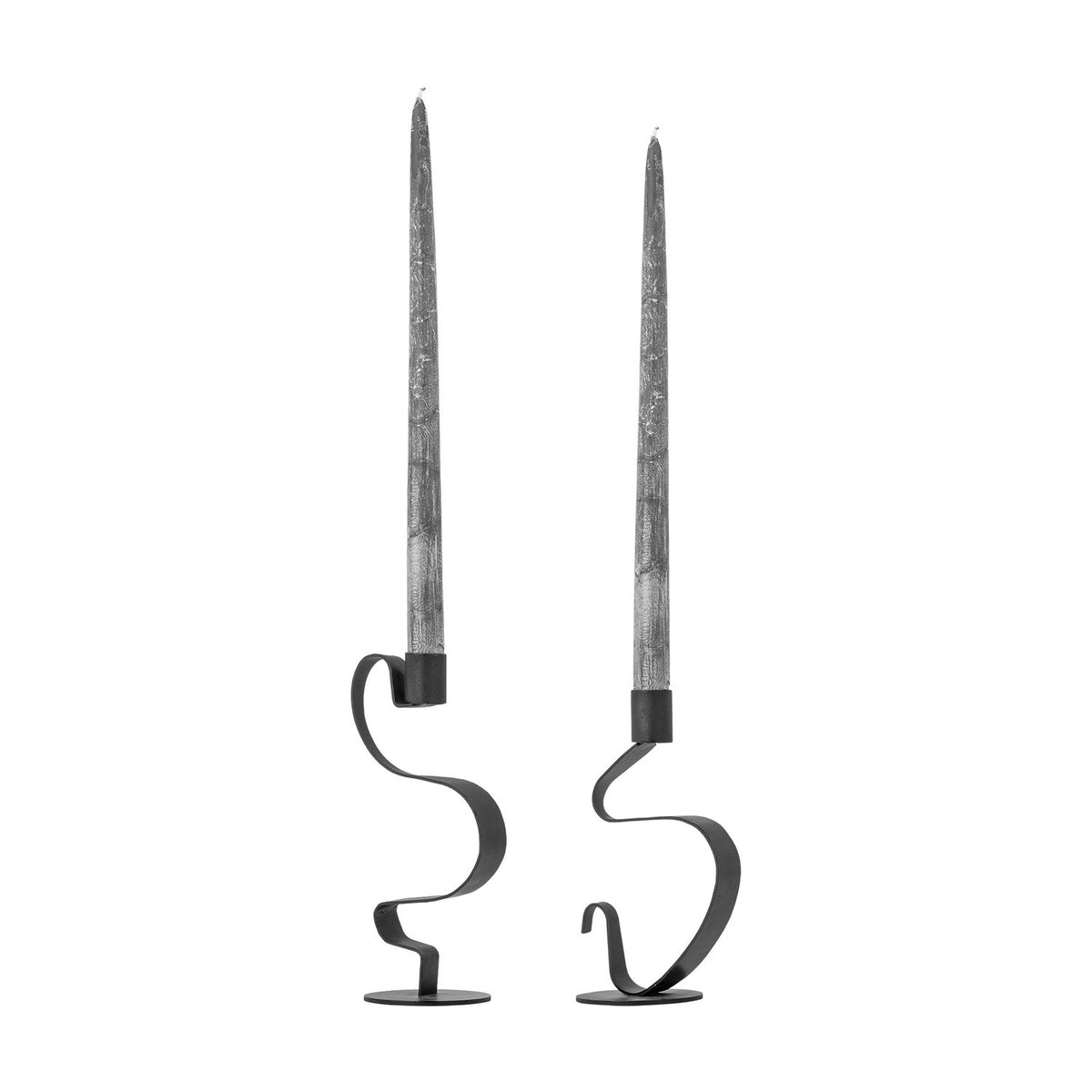 Do Iori Candle Holders Set of 2 in black iron, each with a looping ribbon-metal stem on a round base holding a tall taper candle, shown on a white background.