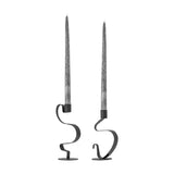 Do Iori Candle Holders Set of 2 in black iron, each with a looping ribbon-metal stem on a round base holding a tall taper candle, shown on a white background.