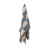 True Checked Cotton Throw in multi blue, cream and brown diagonal check with thick fringed edges, hanging against a plain white background.