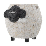 Dolly Sheep water hyacinth storage basket in white with a dark woven face, closed-eye stitched lashes, two ears, and short woven legs, on a plain background.