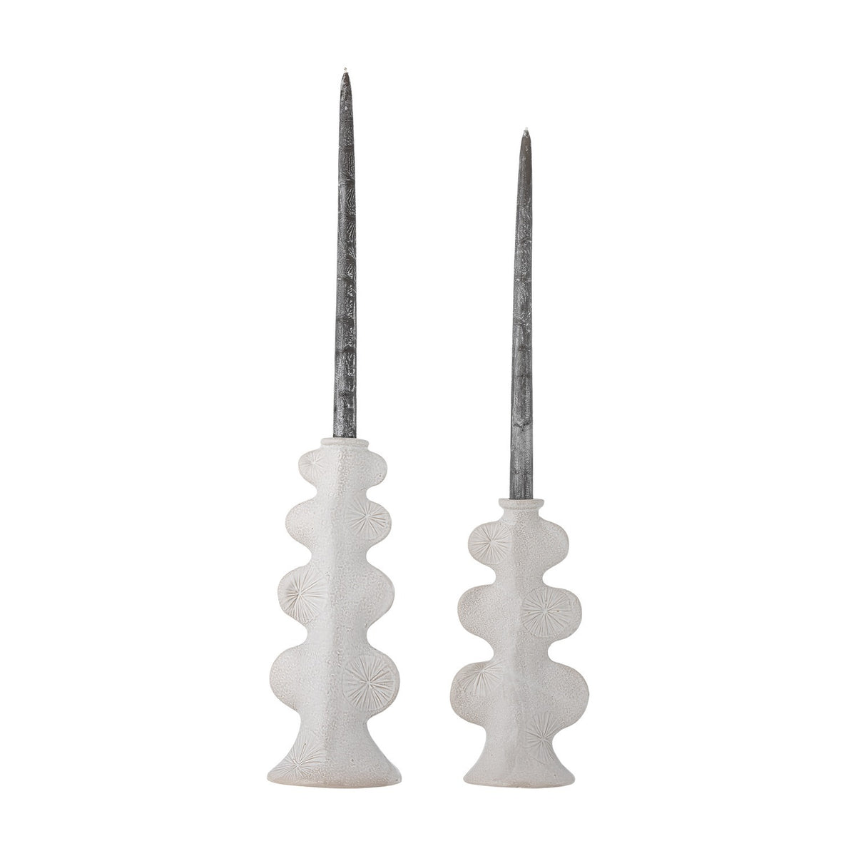 Cason stoneware candle holders, set of 2 in white, with rounded lobed columns, sunburst motifs, and flared feet in varying heights, shown with tapered candles on a plain background.
