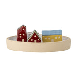 Coze Round Stoneware Candle Holder in multicoloured ceramic, with three glazed houses in red, blue, and yellow beside a central taper cup on a sandy rimmed base, shown on a plain white background.