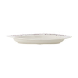 Side view of the Wonderland Wavy Stoneware Christmas Platter in pink, showing its oval shape, scalloped rim with tab ends, and cream stoneware body on a plain white background.