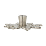 Kashi Snowflake Aluminium Christmas Candle Holder in silver, a flat snowflake-shaped base with a single round taper cup at the centre, shown on a plain white background.
