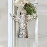 Gold Sarika Iron Christmas angel ornament, 17cm, with mosaic glass detailing, hung from a cream ribbon with a pine sprig.