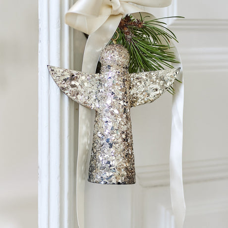 Gold Sarika Iron Christmas angel ornament, 17cm, with mosaic glass detailing, hung from a cream ribbon with a pine sprig.