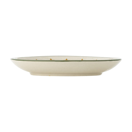 Side view of a cream stoneware Christmas plate from the Peo Star set of 4, showing a shallow rim with a thin green painted line, on a plain white background.