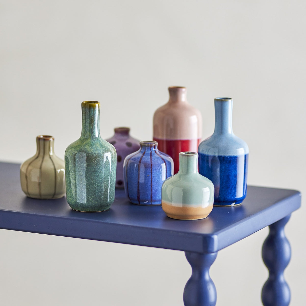 Maien Striped Stoneware Vases, set of 7 small ceramic bottle and rounded vases in green, blue, pink, cream and purple glazes with stripes, dots and two-tone bands.