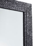Close-up of the charred frame seen at an angle, showing the depth of the crackle running along the timber edge.