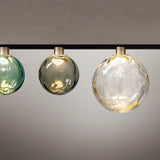 Murané Street 15cm track ceiling light with a round Smoke Grey rippled glass globe on a Brushed Champagne collar, shown centred among green and clear glass versions.