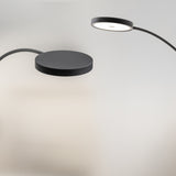 Dip Arc LED outdoor floor lamp in Micaceous Grey, showing the curved arm and round flat disc head with integrated LED, set against a plain light background.