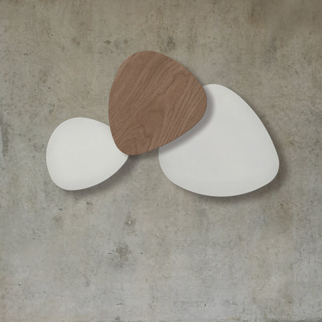 Tria 3 Light Wood LED Wall Light with two overlapping white satin lacquer panels and one natural oak panel, mounted on a plain concrete-toned wall.