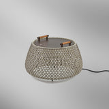 Nans Bag/38 Wood LED outdoor floor lamp with a round, drum-shaped brown woven cord shade, flat dark top, and two teak wood handles, shown on a plain light grey background.
