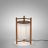 Kando P/76 Ribbon LED floor lamp with a pleated white translucent shade framed by a teak wood structure and dark brown cap, lit against a plain light grey background.
