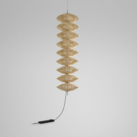 Yuyun S/9L/I fabric LED pendant light with nine stacked woven beige cotton tiers on a slender stem, satin beige finish, shown against a plain light grey background.