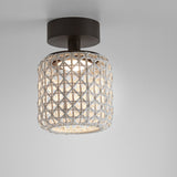 Nans PF/16 semi-flush outdoor ceiling light with a barrel-shaped beige woven shade, graphite brown canopy and stem, integrated warm white LED, shown against a plain grey background.