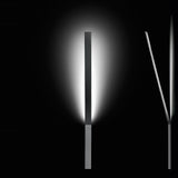 Ypsilon LED Wall Light in chrome, slim rectangular blade angled upward from a wall-mounted block, casting an upward glow against a black background.