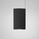 Noren S/72 fabric LED pendant light with a tall curved dark grey panel, black structure, and twin suspension cables, shown against a plain light background.