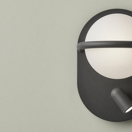 C-Ball W 2 Light Glass Sphere Wall Light in black, with a white globe held by a slim ring on an oval plate and a small integrated reading spotlight below.
