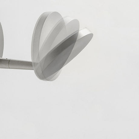 Bella Direct Aluminium LED wall light with round back plate, slim angled arm and flat disc head in brushed silver, shown against a plain white background.