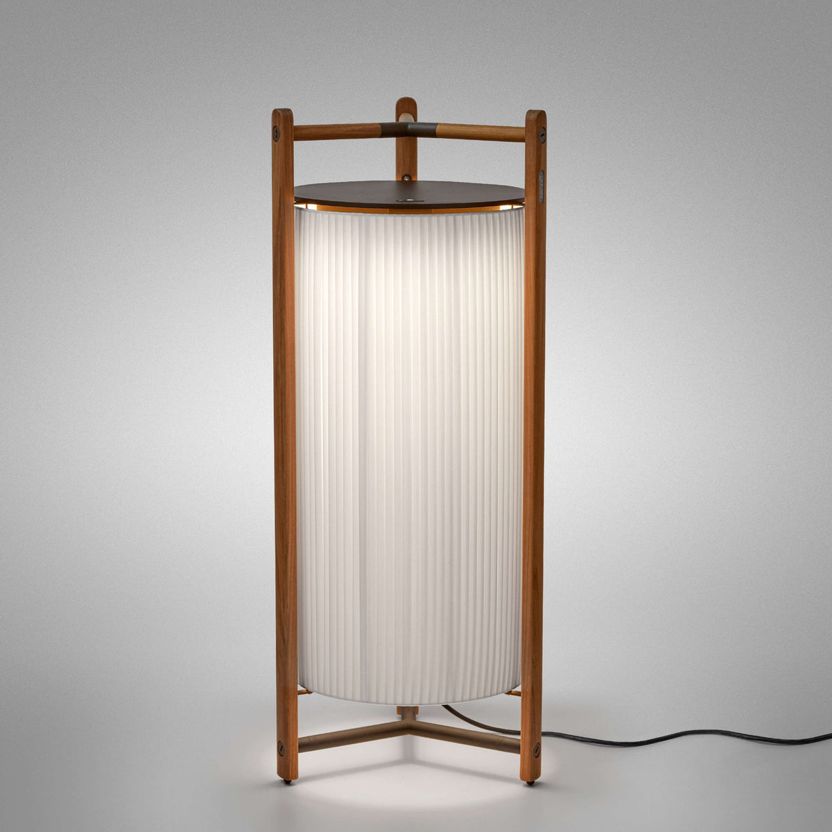 Kando P/111 Ribbon LED floor lamp with pleated white cylindrical shade in a brown wood three-legged frame and dark top disc, shown against a plain grey background.