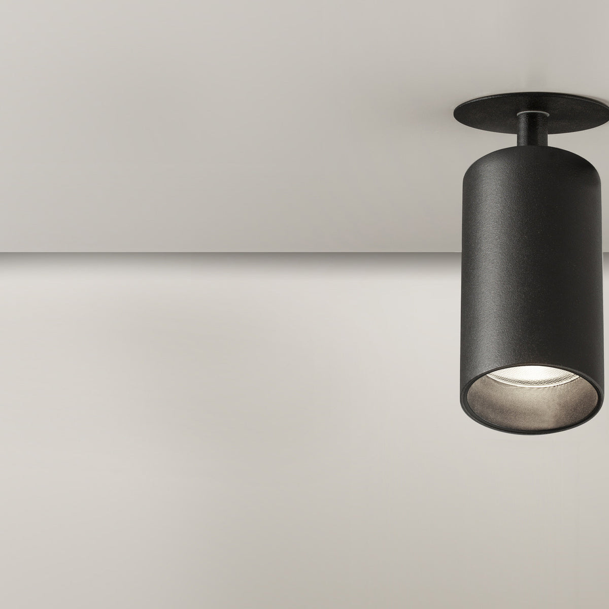Carl Adjustable Recessed LED Downlight 7.1cm in black, round ceiling trim with angled cylindrical head, matt finish, shown against a plain light background.